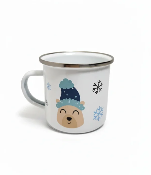 Taza esmaltada navideña blanca con diseño festivo, ideal para café, té o chocolate caliente.